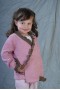 Pink coat with brown ruffles