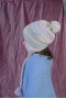 Revertible chullo with pompons