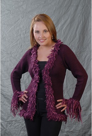 Thick coat with long coloured fringes on the wristbands and neck